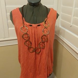 Sleeveless peach top with beautiful neckline